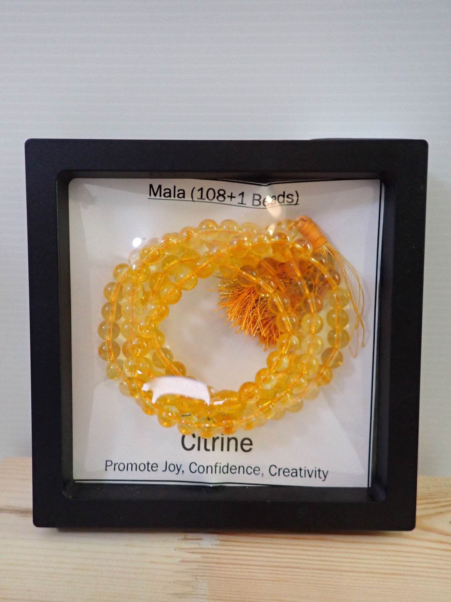Citrine Mala displayed in shadow box frame - Promote Joy Confidence Creativity