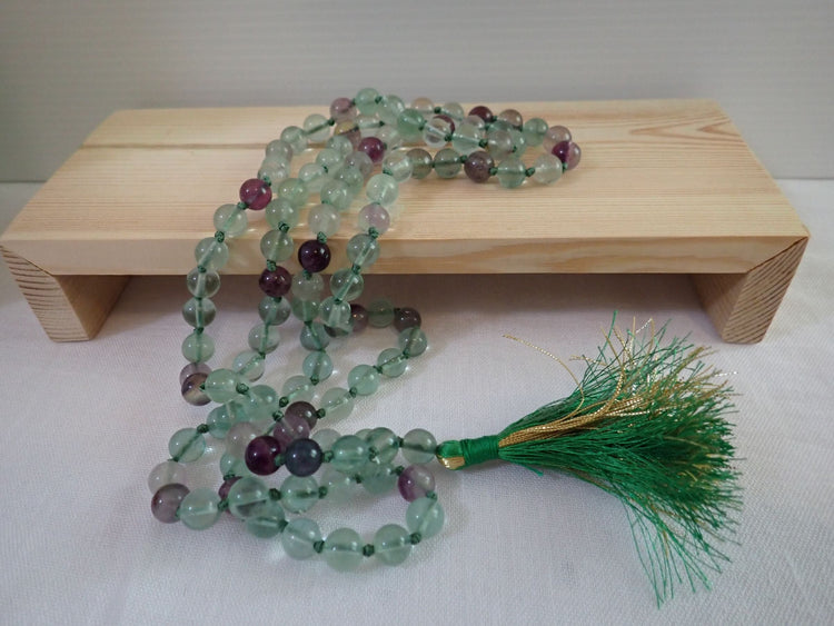 Fluorite Mala displayed in shadow box frame