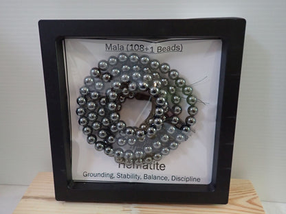 Hematite Mala displayed in shadow box frame - Grounding Stability Balance Discipline